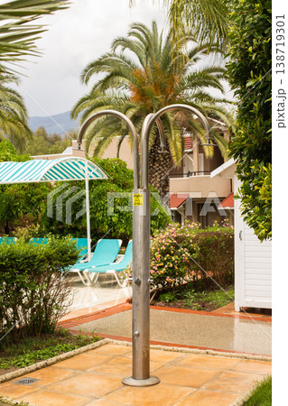 Outdoor shower by tropical pool area resort vacation Outdoor shower by tropical pool area resort vacation 138719301
