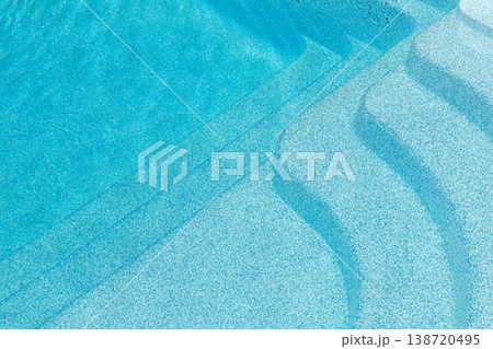 New modern fiberglass plastic swimming pool entrance step with clean fresh refreshing blue water on bright hot summer day at yard or resort hotel spa area. Wooden flooring deck of teak or larch board New modern fiberglass plastic swimming pool entrance step with clean fresh refreshing blue water on bright hot summer day at yard or resort hotel spa area. Wooden flooring deck of teak or larch board 138720495