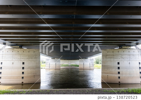 Massive canal bridge Magdeburg waterway river powerful steel beam concrete pillars dramatic symmetrical perspective. Industrial engineering landmark water reflections transport infrastructure Massive canal bridge Magdeburg waterway river powerful steel beam concrete pillars dramatic symmetrical perspective. Industrial engineering landmark water reflections transport infrastructure 138720523