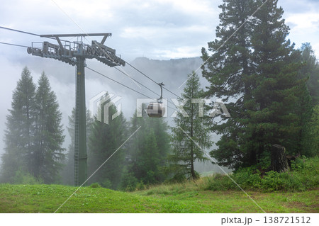 Scenic Mountain Cable Car Cabin Above Foggy Pine Forest Landscape Travel Destination Scenic Mountain Cable Car Cabin Above Foggy Pine Forest Landscape Travel Destination 138721512