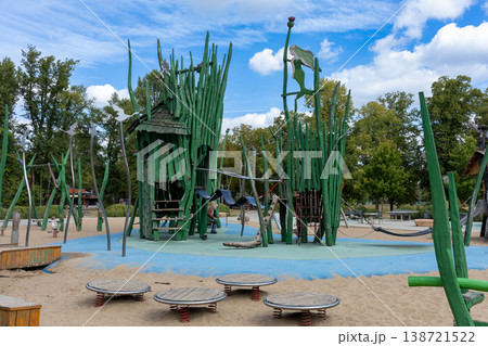 Fantasy Themed Wooden Playground Tower With Climbing Net And Slide In City Park Fantasy Themed Wooden Playground Tower With Climbing Net And Slide In City Park 138721522