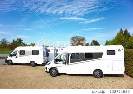 Modern Motorhome Camper Van Parking Area With Multiple Recreational Vehicles Outdoor Travel Lifestyle 138721689