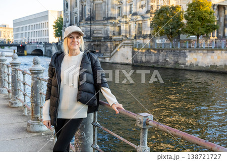 Stylish Woman Standing By River In European City Urban Lifestyle 138721727