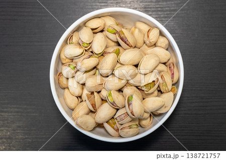 Salted Pistachio Nut in Bowl Top View Healthy Snack Food Background 138721757