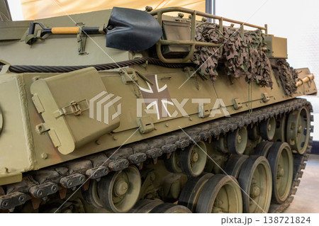 Armored Military Tank Side View With Camouflage Netting And Track System Detail Armored Military Tank Side View With Camouflage Netting And Track System Detail 138721824