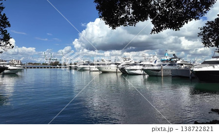 Private luxury boat anchored off Miami beach. Summer boat vacation. Miami yachting. Yacht vacation in summer. Marina bay. Luxury motor yacht in sea marina bay. Yacht in navigation. Marina bay 138722821