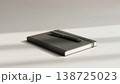 Calm morning scene featuring notebook and pen placement 138725023