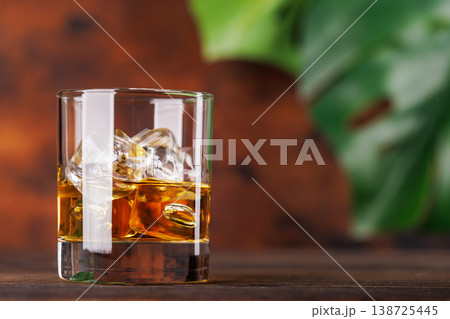 Glass of whiskey with ice 138725445