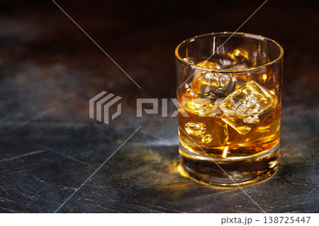 Glass of whiskey with ice 138725447