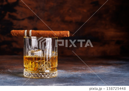Glass of whiskey with ice and cigar Glass of whiskey with ice and cigar 138725448
