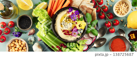 Colorful Hummus Platter with Fresh Vegetables and Pita Colorful Hummus Platter with Fresh Vegetables and Pita 138725687