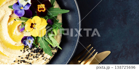 Gourmet Hummus with Edible Flowers and Black Sesame Seeds Gourmet Hummus with Edible Flowers and Black Sesame Seeds 138725696