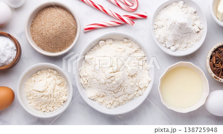 Ingredients for making dough are set on a kitchen table, including flour, butter, and sugar, preparing for baking cookies ahead of the holiday season Ingredients for making dough are set on a kitchen table, including flour, butter, and sugar, preparing for baking cookies ahead of the holiday season 138725948