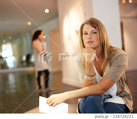 Portrait, creative and a woman at a gallery for art, exhibition or looking at culture creativity. Young, weekend a girl or person at a museum for paintings, drawings or collection on display 138726221