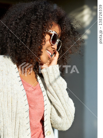Travel, phone call and happy black woman in a city for contact, communication or weekend freedom. Smartphone, conversation and fashionable African lady traveler in a street for networking discussion Travel, phone call and happy black woman in a city for contact, communication or weekend freedom. Smartphone, conversation and fashionable African lady traveler in a street for networking discussion 138726339