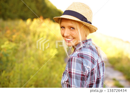 Smile, walking and portrait of woman in nature with a straw hat in an outdoor garden for fresh air. Happy, fashion and female person from Australia in the forest, woods or field with casual style. Smile, walking and portrait of woman in nature with a straw hat in an outdoor garden for fresh air. Happy, fashion and female person from Australia in the forest, woods or field with casual style. 138726434