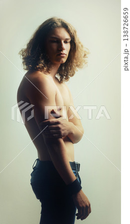 Man, serious and shirtless in studio for fitness, wellness and body on white background. Model, person and topless for health, selfcare or healthy with fashion jeans, confidence and exercise Man, serious and shirtless in studio for fitness, wellness and body on white background. Model, person and topless for health, selfcare or healthy with fashion jeans, confidence and exercise 138726659