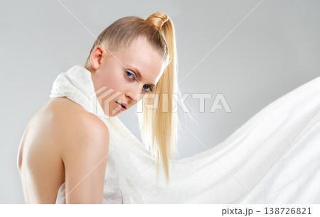 Beauty, makeup and fabric, portrait of woman in studio with skin glow, creative facial and luxury skincare. Fashion, cosmetics and face of model with unique aesthetic on white background with silk. 138726821