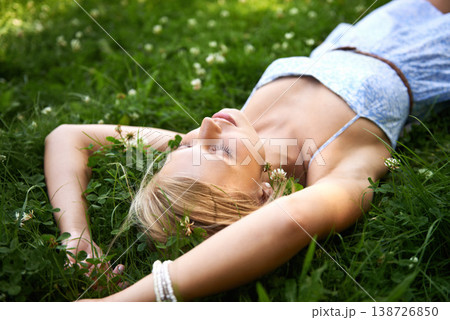 Relax, outdoor and woman with nature, field and summer with peace, vacation and sleeping. Person, park and girl on the ground, sunshine and happiness with fantasy, daydreaming and calm with ideas 138726850