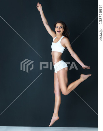 Happy woman, body and jump in underwear for diet, weight loss or fitness against a studio background. Attractive or slim female person, athlete or model smile in health, portrait and wellness mockup 138726914