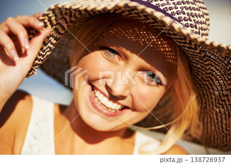 Portrait, smile and summer with a woman closeup outdoor on holiday or vacation for travel and freedom. Face, freedom and straw hat with a happy young tourist outside in the sun to relax on a getaway Portrait, smile and summer with a woman closeup outdoor on holiday or vacation for travel and freedom. Face, freedom and straw hat with a happy young tourist outside in the sun to relax on a getaway 138726937