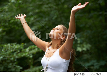 Peace, freedom and a woman arms raised in the forest for mental health, wellness or zen meditation. Summer, nature and a young person in the countryside to relax for balance, mindfulness or awareness 138726966