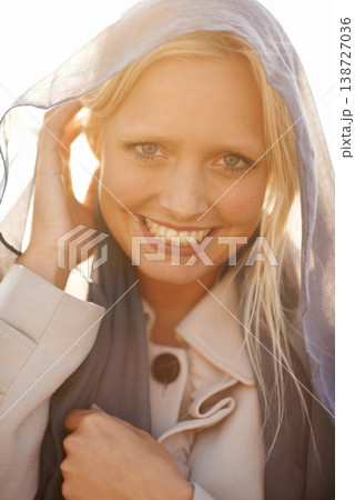 Portrait, smile and wind with a woman in summer, outdoor for freedom, travel or adventure during the day. Face, happy and a young person closeup in nature for holiday or vacation as a tourist 138727036