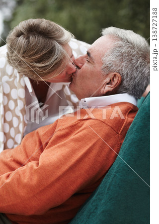 Kiss, love and senior couple relax in a backyard with freedom, fun and bonding at home together. Gratitude, care and old people with passion, security or support in a yard sharing a romantic moment Kiss, love and senior couple relax in a backyard with freedom, fun and bonding at home together. Gratitude, care and old people with passion, security or support in a yard sharing a romantic moment 138727188