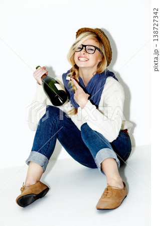 Fashion, wine and portrait of happy woman in a studio with a trendy, cool and stylish outfit and accessories. Confident, smile and female model from Australia with alcohol drink by white background. 138727342