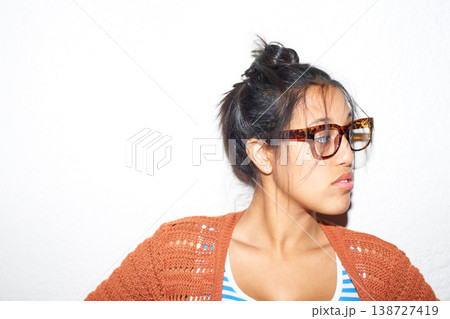 Face, vision and glasses with the attitude of a woman in studio isolated on a white background for style. Fashion, thinking and eyewear with a confident young person on space in a trendy outfit Face, vision and glasses with the attitude of a woman in studio isolated on a white background for style. Fashion, thinking and eyewear with a confident young person on space in a trendy outfit 138727419