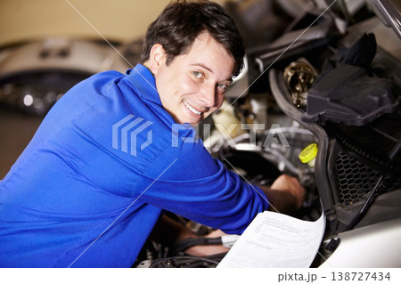 Portrait, happy man and mechanic with document on engine of car, repair or maintenance. Smile, face and technician with paperwork on motor vehicle, auto service or workshop, garage or small business 138727434