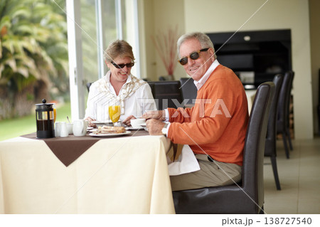 Breakfast, portrait and senior couple in restaurant on romantic date together in on summer morning. Old man, happy woman and smile in luxury hospitality, fine dining and relax in cafe with sunglasses 138727540