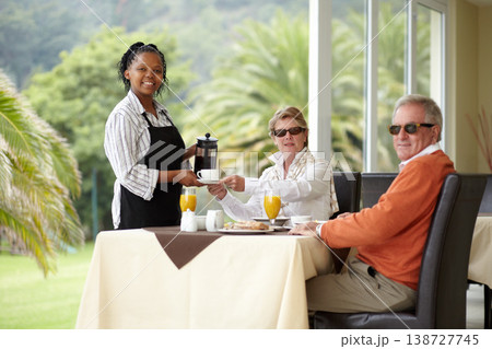 Waitress, coffee and elderly couple on restaurant patio on romantic date together in portrait. Old man, woman and server with breakfast drink service in luxury hospitality, hotel and relax on terrace Waitress, coffee and elderly couple on restaurant patio on romantic date together in portrait. Old man, woman and server with breakfast drink service in luxury hospitality, hotel and relax on terrace 138727745