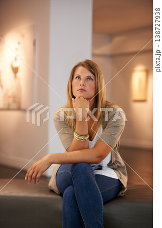 Thinking, creative and woman at a gallery for art, exhibition or education on culture. Idea, studying and a girl looking at creativity or paintings in a museum for inspiration, learning or collection Thinking, creative and woman at a gallery for art, exhibition or education on culture. Idea, studying and a girl looking at creativity or paintings in a museum for inspiration, learning or collection 138727938