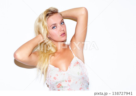 Fashion, portrait and woman in a dress in a studio for trendy, stylish and elegant style. Confidence, serious and young beautiful female person from Australia in cute outfit by white background. Fashion, portrait and woman in a dress in a studio for trendy, stylish and elegant style. Confidence, serious and young beautiful female person from Australia in cute outfit by white background. 138727941