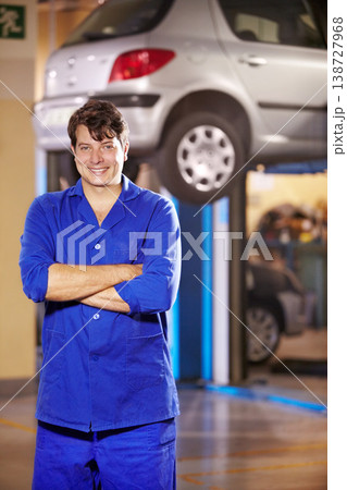 Portrait, happy man and mechanic with arms crossed at garage, service workshop or business. Confident, smile or professional technician, motor car repair expert or auto maintenance engineer in Canada Portrait, happy man and mechanic with arms crossed at garage, service workshop or business. Confident, smile or professional technician, motor car repair expert or auto maintenance engineer in Canada 138727968