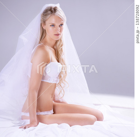 Woman, bride and lingerie in studio or sensual boudoir, marriage commitment or wedding day lace. Female person, face and underwear corset for honeymoon veil seductive romance, wall background or skin Woman, bride and lingerie in studio or sensual boudoir, marriage commitment or wedding day lace. Female person, face and underwear corset for honeymoon veil seductive romance, wall background or skin 138728092