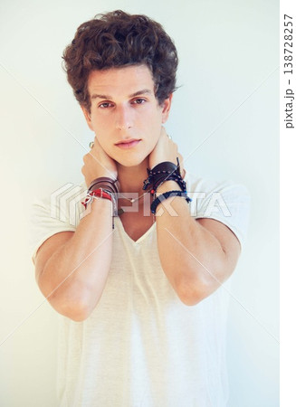 Cool, accessories or portrait of person in studio on a white background for fashion, swag or unique style. Jewelry, man or bracelet on arms of a young punk male model for trendy or edgy expression Cool, accessories or portrait of person in studio on a white background for fashion, swag or unique style. Jewelry, man or bracelet on arms of a young punk male model for trendy or edgy expression 138728257