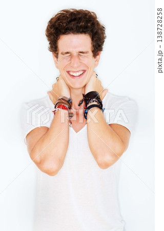 Smile, fashion and an edgy young male model in studio isolated on white background for rocker style. Accessories, eyes closed and a funky punk man in a casual clothes outfit for individual expression Smile, fashion and an edgy young male model in studio isolated on white background for rocker style. Accessories, eyes closed and a funky punk man in a casual clothes outfit for individual expression 138728258