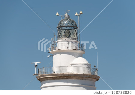 Upper section of La Farola lighthouse with lantern room and railings. Malaga, Spain Upper section of La Farola lighthouse with lantern room and railings. Malaga, Spain 138728826