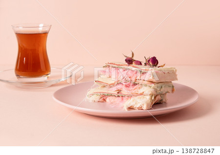 Minimal pastel dessert with tea glass elegant food styling concept Minimal pastel dessert with tea glass elegant food styling concept 138728847
