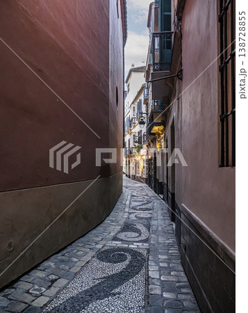 Narrow Cobblestone Alley With Mosaic Path and Balconies in Historic Mediterranean Old Town Malaga Narrow Cobblestone Alley With Mosaic Path and Balconies in Historic Mediterranean Old Town Malaga 138728855