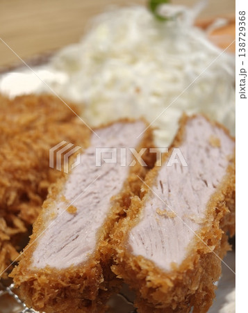 Crispy Tonkatsu Sliced to Reveal Juicy Pork Interior Closeup 138729368