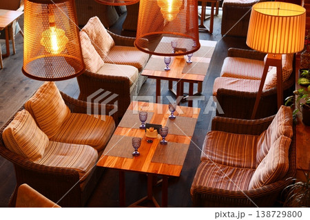 Relaxed environment with illuminated tables and casual gathering spaces Relaxed environment with illuminated tables and casual gathering spaces 138729800