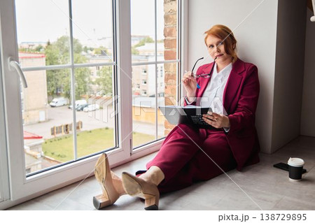 Woman designing brand ideas during relaxed creative session 138729895