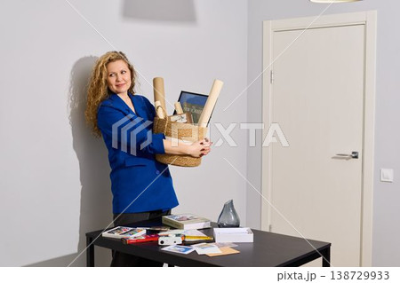White woman courier delivering handcrafted goods in woven basket 138729933