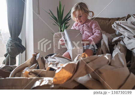 Excited 4 year old girl unboxing a huge delivery parcel at home Excited 4 year old girl unboxing a huge delivery parcel at home 138730199