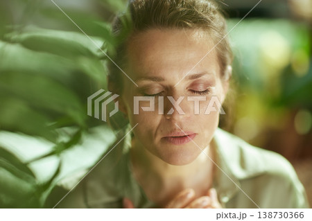Woman Practicing Mindful Breathing with Hands on Chest Woman Practicing Mindful Breathing with Hands on Chest 138730366