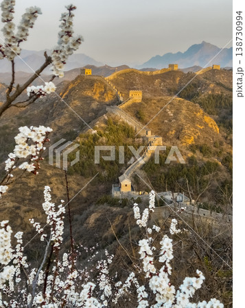 Golden light bathes ancient walls winding through hills Golden light bathes ancient walls winding through hills 138730994