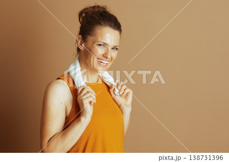 Radiant Woman with Towel, Post-Exercise Radiant Woman with Towel, Post-Exercise 138731396